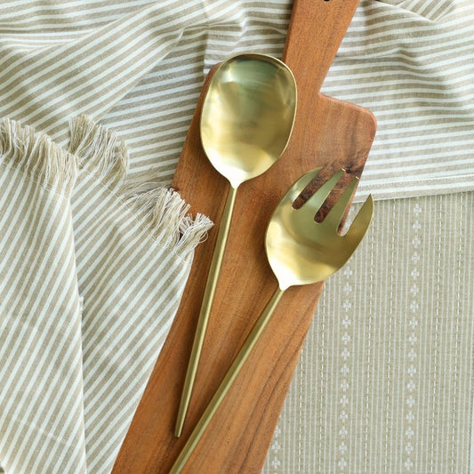 Matte gold salad servers, with a serving spoon and four-tine fork