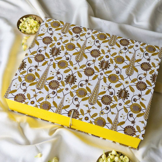 Large hamper gift box with patterned lid and yellow trim, tilted view