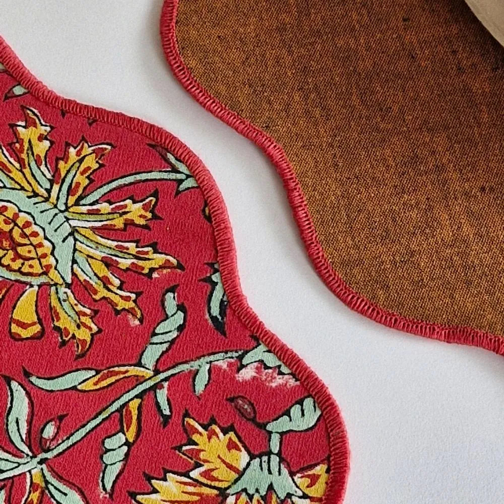 Acres Wild Placemats by The Yard House in vibrant red, featuring floral designs; available in rectangular (12" x 17") and ...