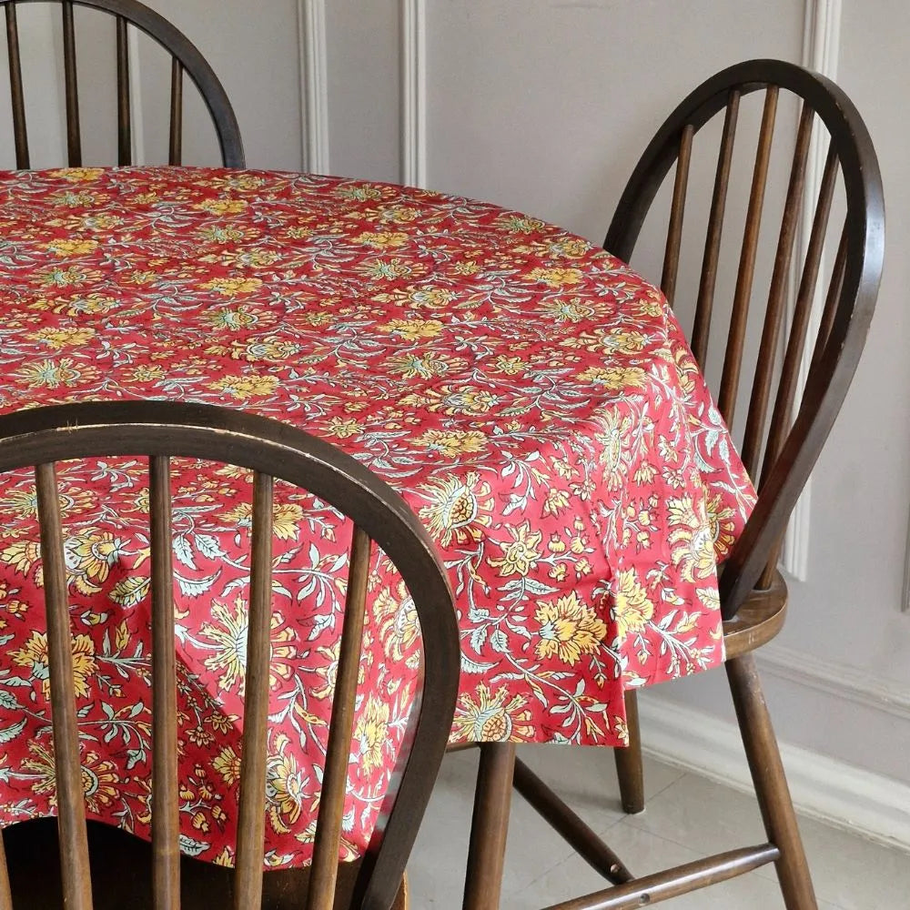 Acres Wild wipeable anti-slip cotton tablecloth by The Yard House in bold red, featuring floral designs, available in vari...