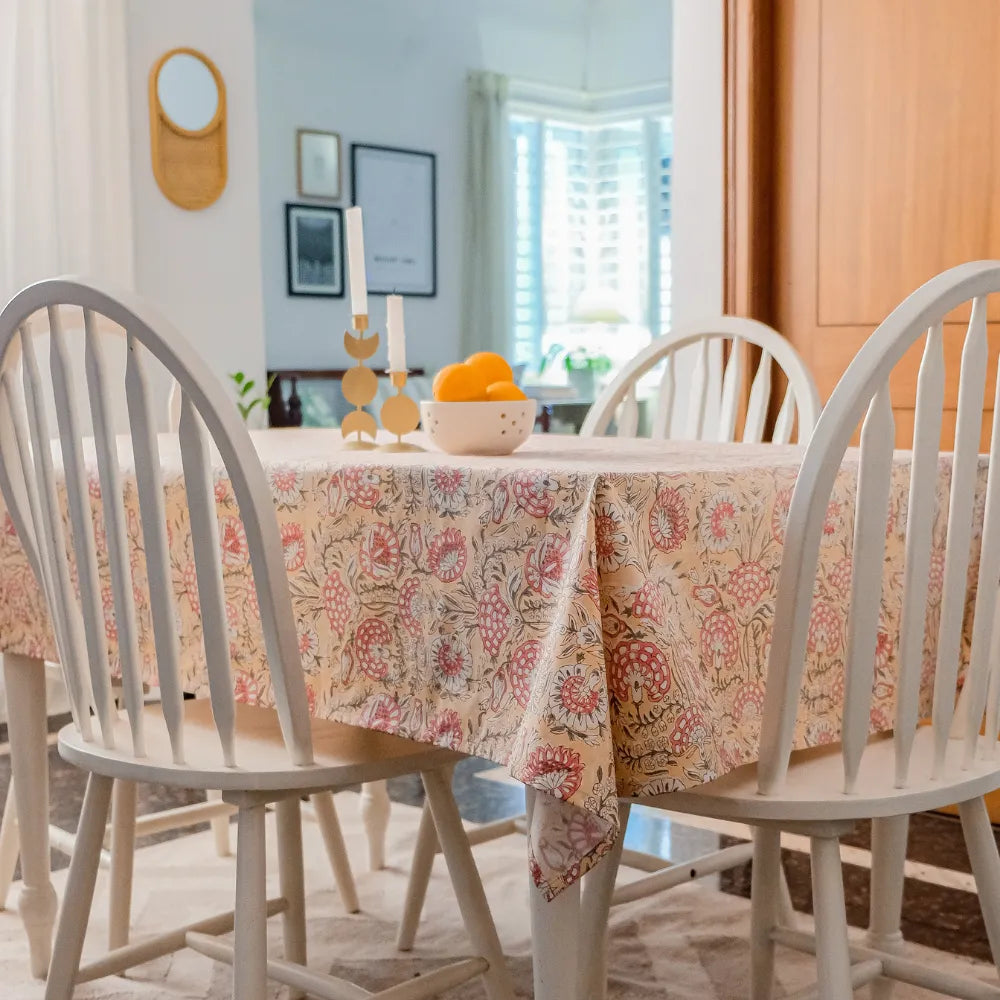 Blushing Meadows Tablecloth by The Yard House in pastel peach and pink, available in rectangle (48”x72”), square (60”x60”)...