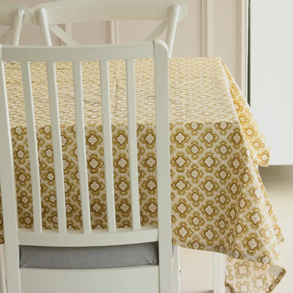 Chai & Toast Tablecloth by The Yard House in beige and brown, featuring geometric patterns, available in 4-seater round, s...