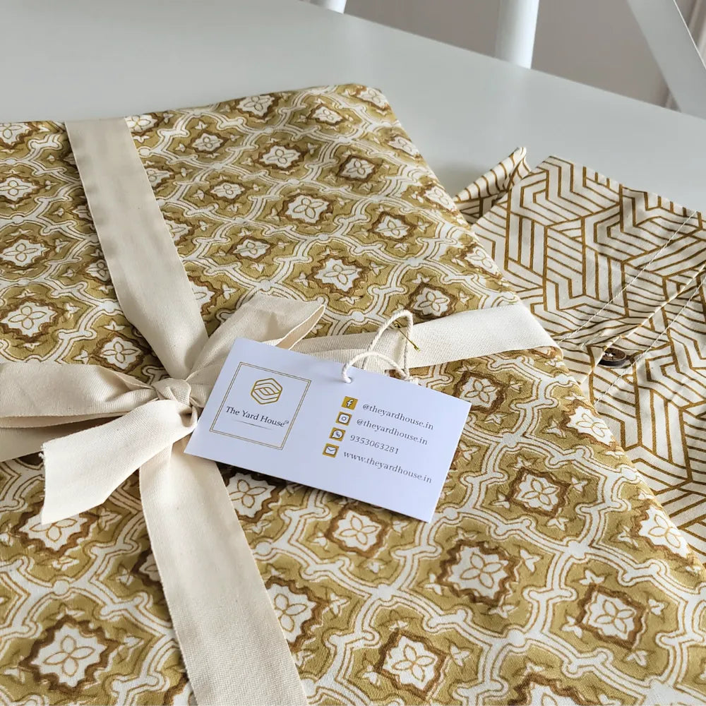 Chai & Toast Tablecloth by The Yard House in beige and brown, featuring geometric patterns, available in 4-seater round, s...