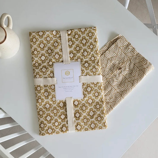 Chai & Toast Tablecloth by The Yard House in beige and brown, featuring geometric patterns, available in 4-seater round, s...