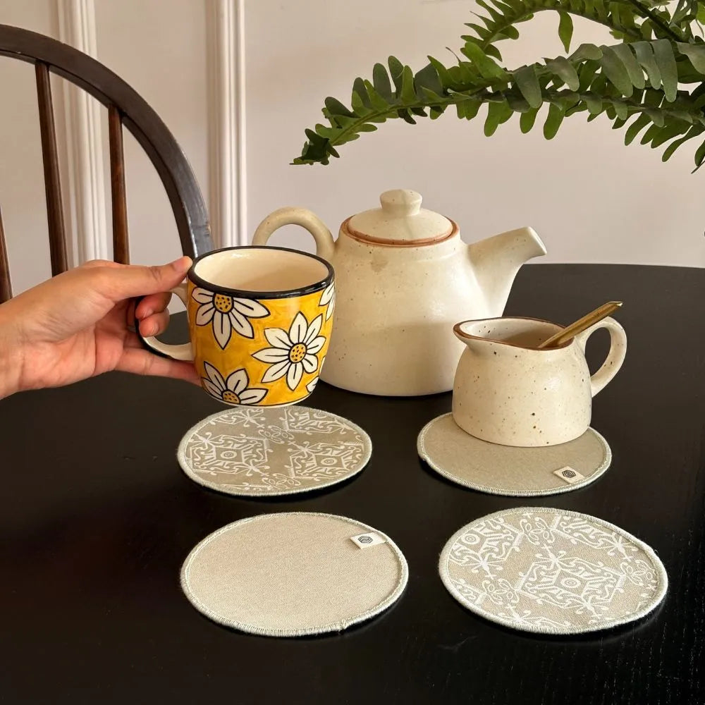 Set of 4 Dholpur Beige cotton coasters by The Yard House, ideal kitchen essentials for protecting surfaces.