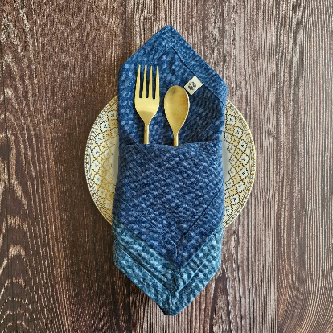 Aegean Blue cotton table napkins from The Yard House, set of 4, featuring bold colors and geometric patterns from the Bhuj...