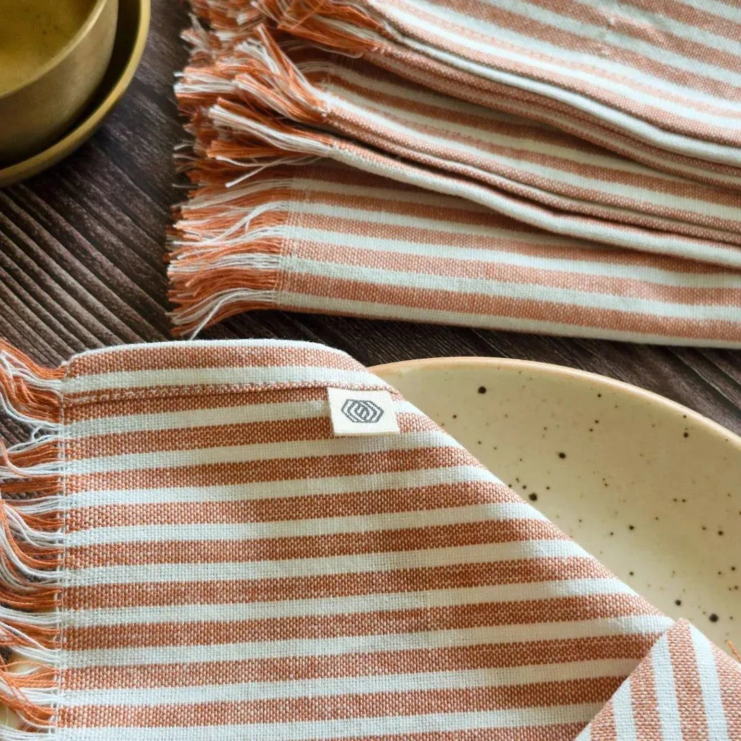 Dusty Rose Cotton Table Napkins by The Yard House, set of 4, featuring floral designs and nature-inspired prints.