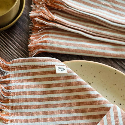 Dusty Rose Cotton Table Napkins by The Yard House, set of 4, featuring floral designs and nature-inspired prints.