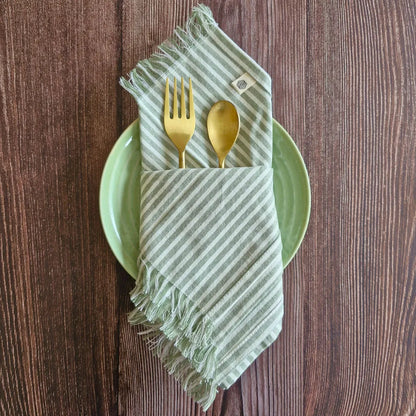 Sage Mirage Cotton Table Napkins by The Yard House, set of 4 in sage green, perfect kitchen essentials for stylish dining.