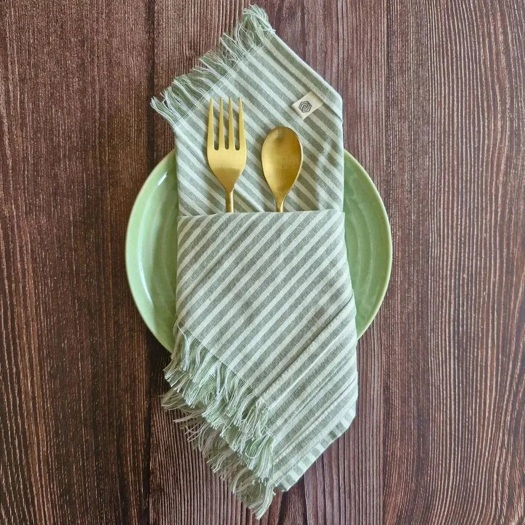 Sage Mirage Cotton Table Napkins by The Yard House, set of 4 in sage green, perfect kitchen essentials for stylish dining.