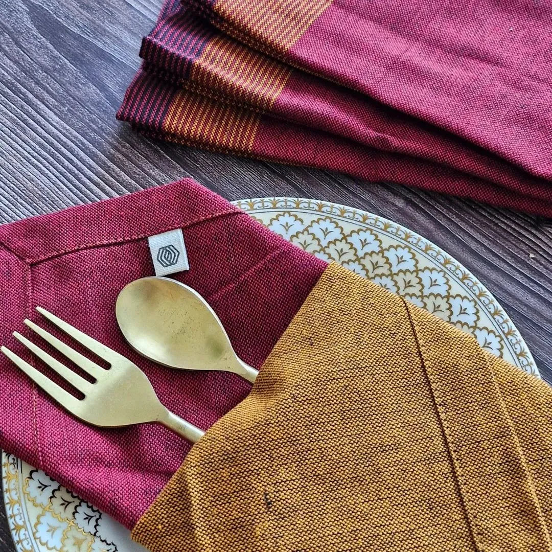 Cotton table napkins in Serene Sunset by The Yard House, featuring bold colors and geometric patterns, available in sets o...
