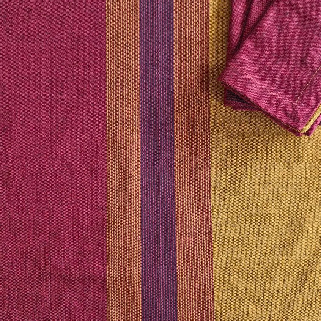 Cotton table napkins in Serene Sunset by The Yard House, featuring bold colors and geometric patterns, available in sets o...