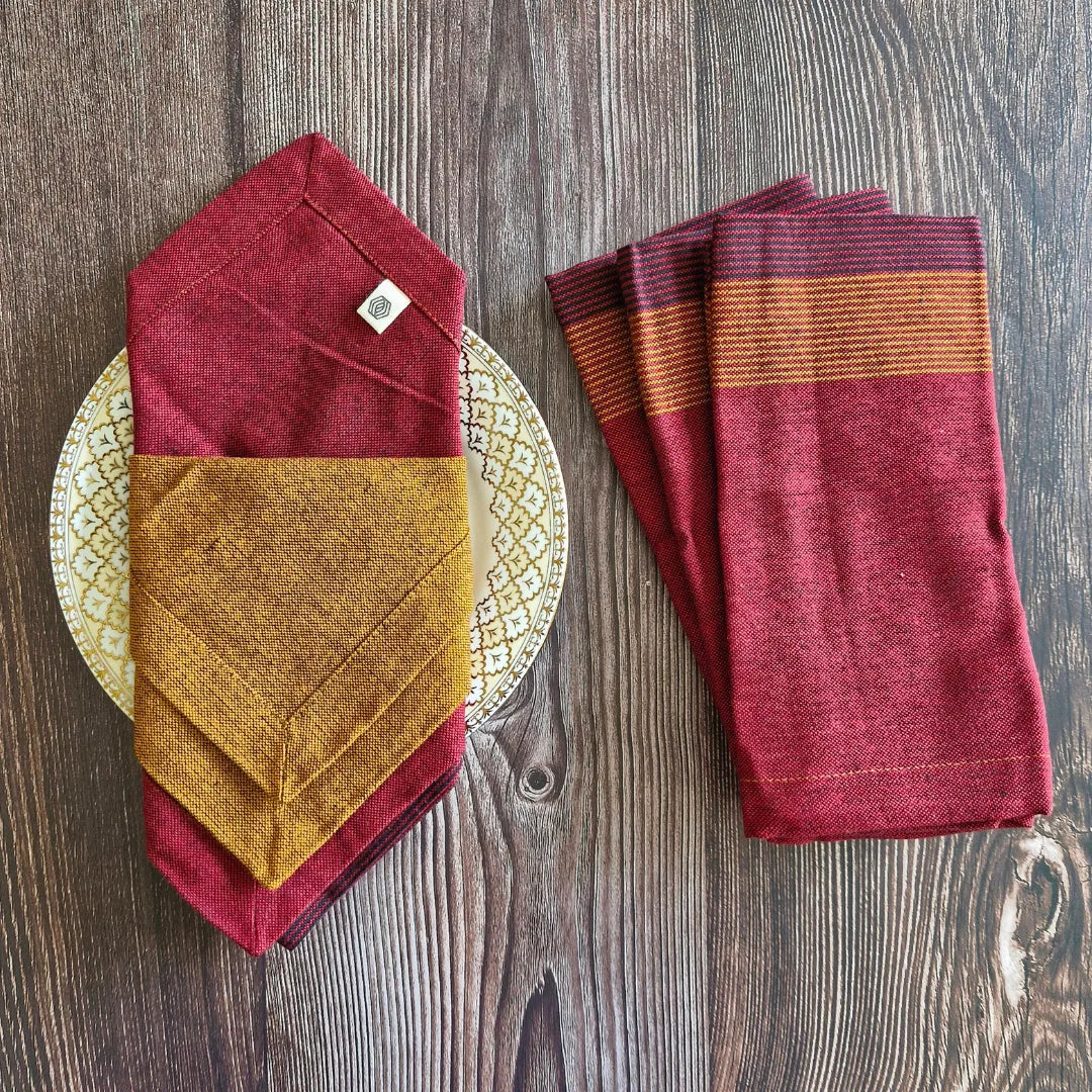 Cotton table napkins in Serene Sunset by The Yard House, featuring bold colors and geometric patterns, available in sets o...