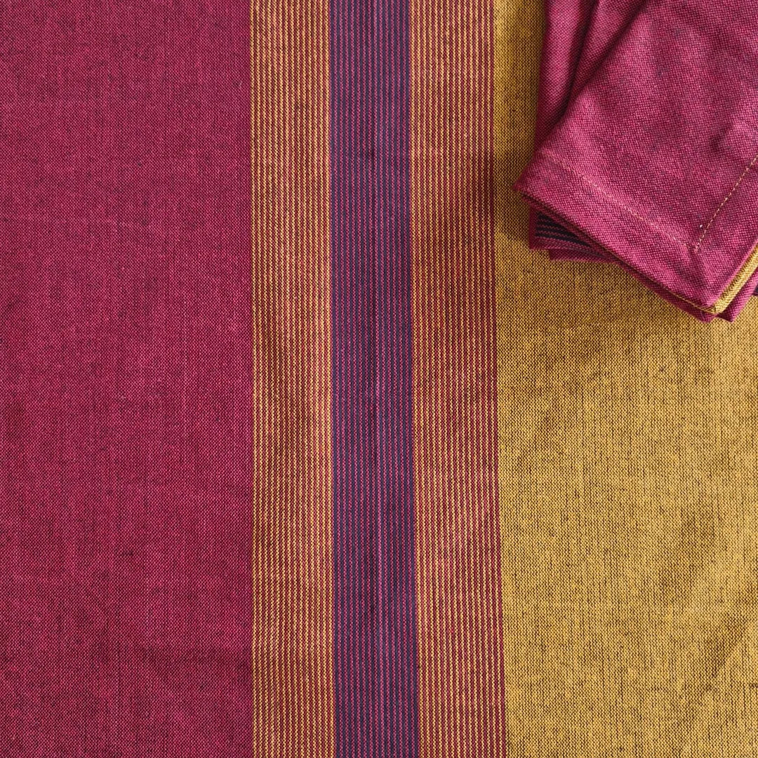 Cotton table napkins in Serene Sunset by The Yard House, featuring bold colors and geometric patterns, available in sets o...
