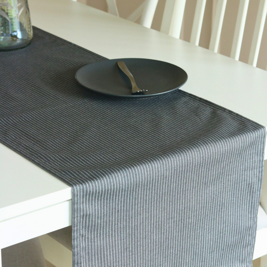 Dark Slate Runner by The Yard House in dark grey, 80"x14", featuring geometric patterns, perfect for minimalist table sett...