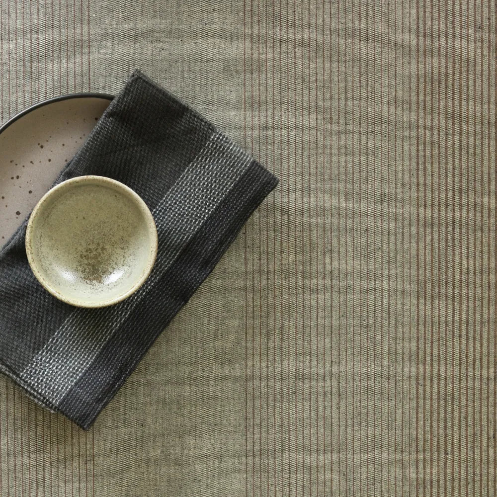 Drifting Wood Tablecloth by The Yard House in Grey Brown, available in square (60”x60”), round (60”), and rectangle (48”x7...