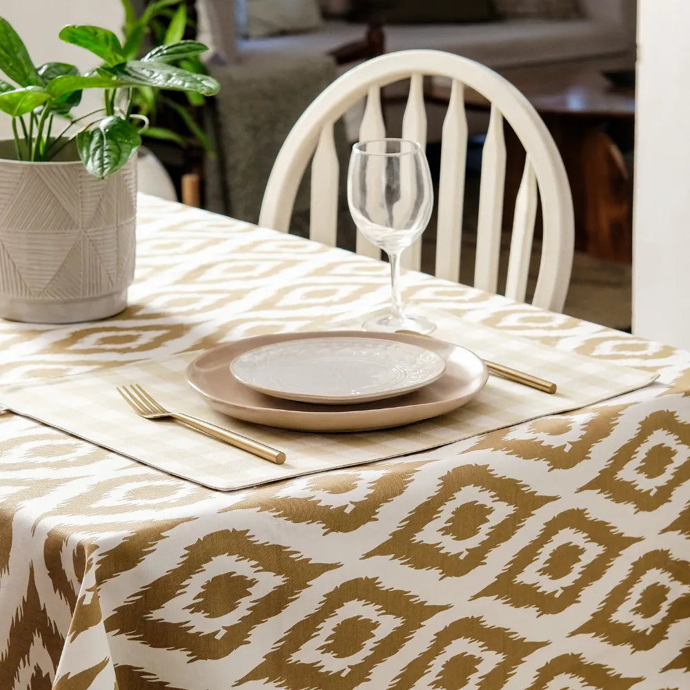 Ikat Inspired Beige Tablecloth by The Yard House, featuring abstract geometric patterns, available in 60” round or square ...