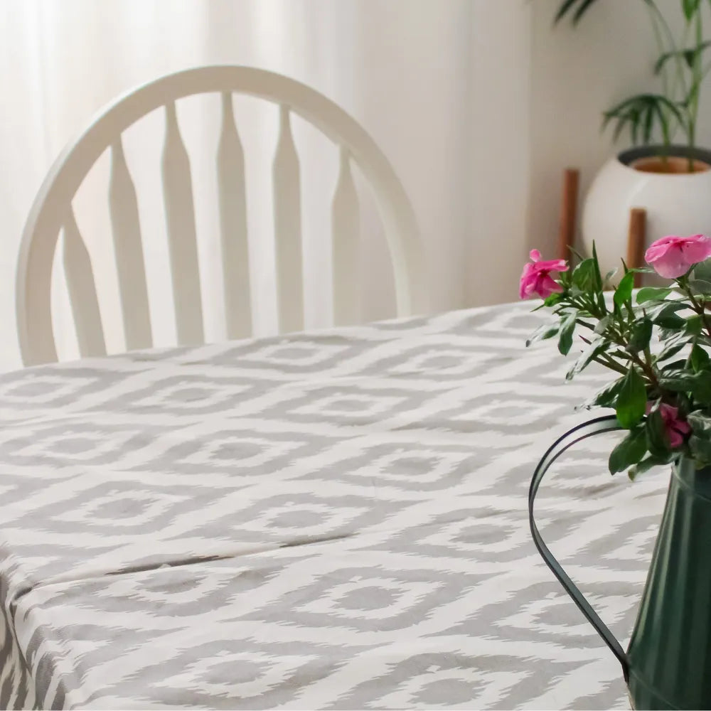 Ikat Inspired Grey Tablecloth by The Yard House, featuring abstract geometric patterns, available in 60” round, square, an...
