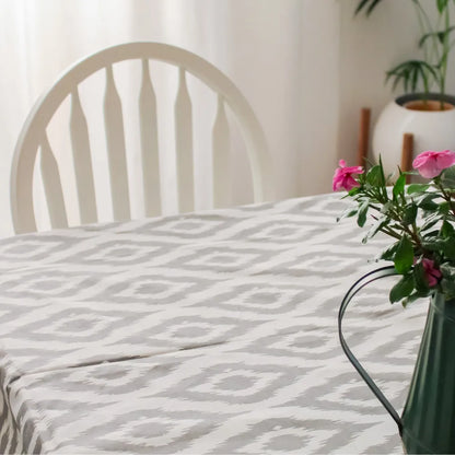 Ikat Inspired Grey Tablecloth by The Yard House, featuring abstract geometric patterns, available in 60” round, square, an...