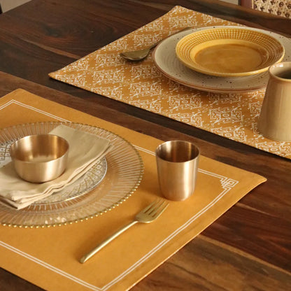 Jaisalmer Placemats by The Yard House in ochre, featuring bold geometric patterns, available in rectangular and scalloped ...