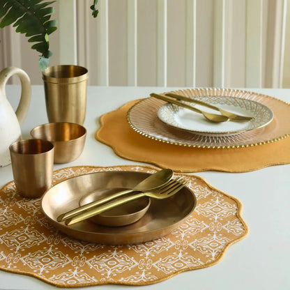 Jaisalmer Placemats by The Yard House in ochre, featuring bold geometric patterns, available in rectangular and scalloped ...