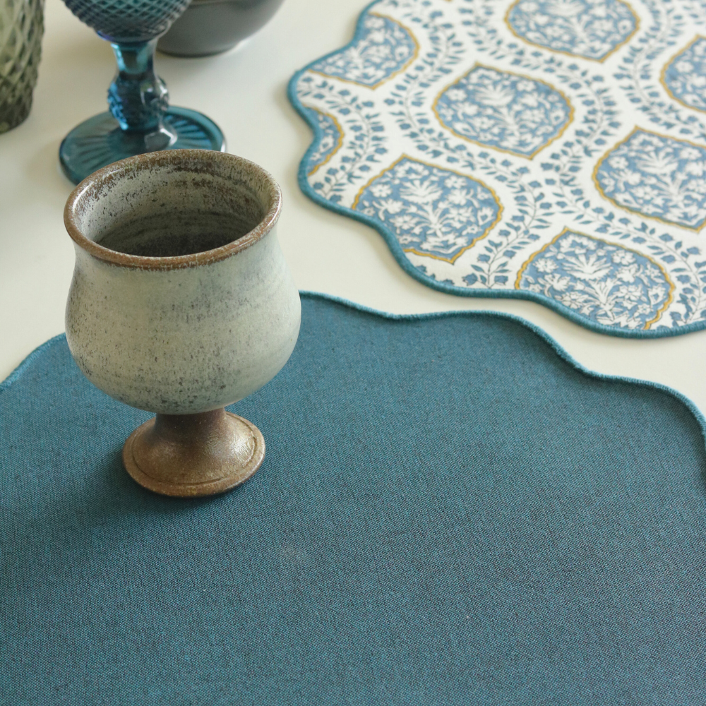 Morning Dew & Woven Aegean Blue Placemats by The Yard House, set of 4, 12" x 17", featuring geometric patterns in blue grey.