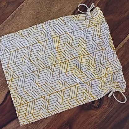 Elegant 10"x10" drawstring gift pouch by The Yard House in signature print, perfect for coasters and trivets.
