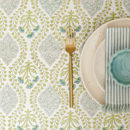 Riverside Tablecloth by The Yard House in Blue Green, 60” round, features geometric patterns and nature-inspired prints.