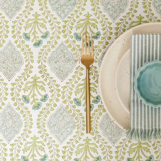 Riverside Tablecloth by The Yard House in Blue Green, 60” round, features geometric patterns and nature-inspired prints.