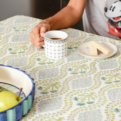 Riverside Tablecloth by The Yard House in blue-green, 60” round, featuring elegant block-printed geometric patterns.