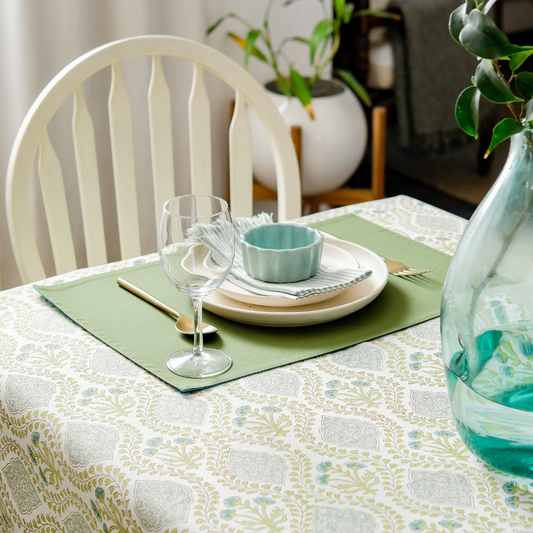 Riverside Tablecloth by The Yard House in blue-green, 60” round, featuring elegant block-printed geometric patterns.