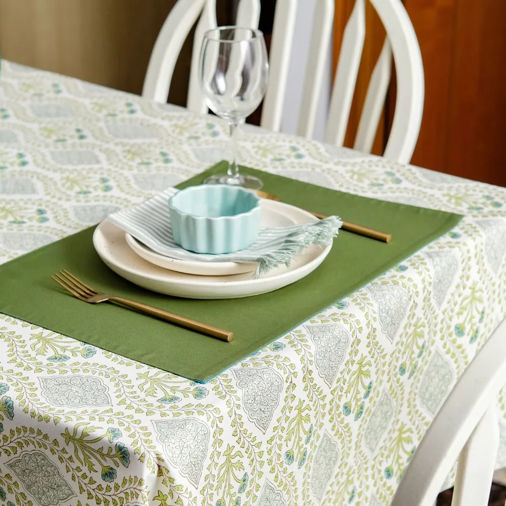 Riverside Tablecloth by The Yard House in Blue Green, 60” round, features geometric patterns and minimalist prints in neut...