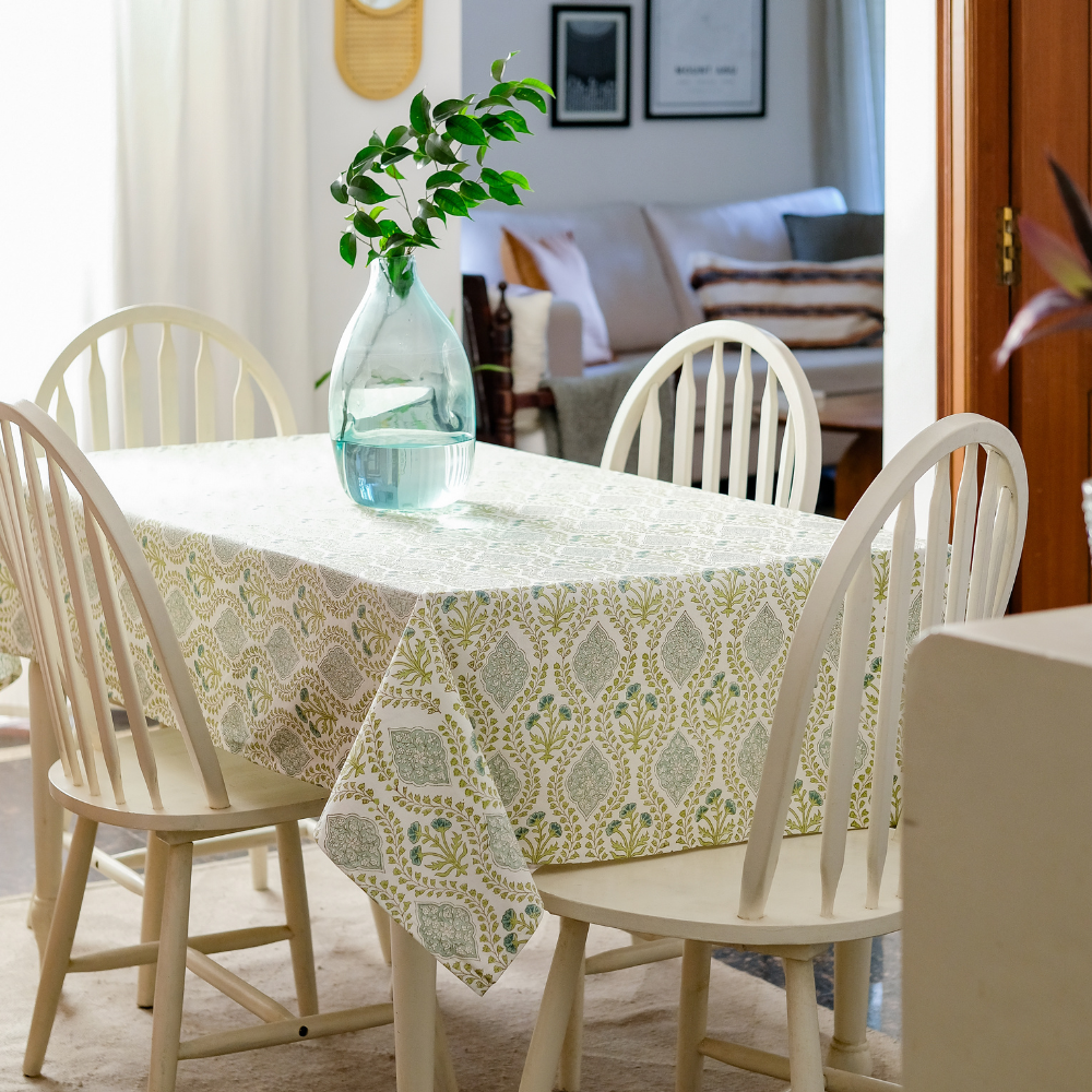 Riverside Tablecloth by The Yard House in blue-green, 60” round, featuring elegant block-printed geometric patterns.