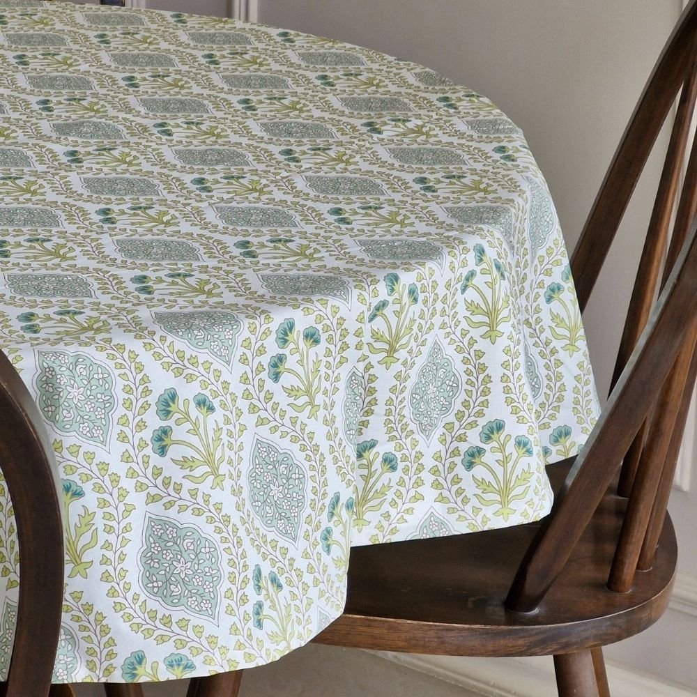 Riverside Tablecloth by The Yard House in blue-green, 60” round, featuring elegant block-printed geometric patterns.