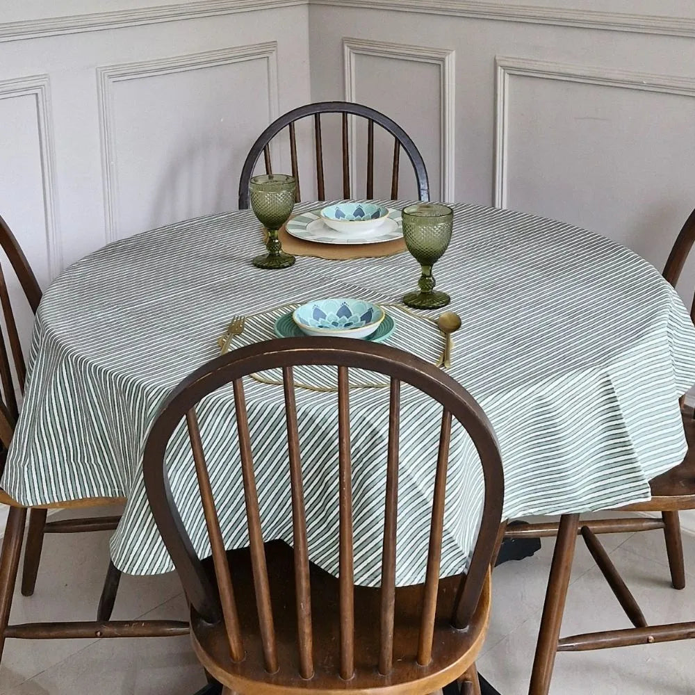 Sage Mirage Tablecloth by The Yard House in sage green, available in rectangle (48”x72”), square (60”x60”), and round (60”...
