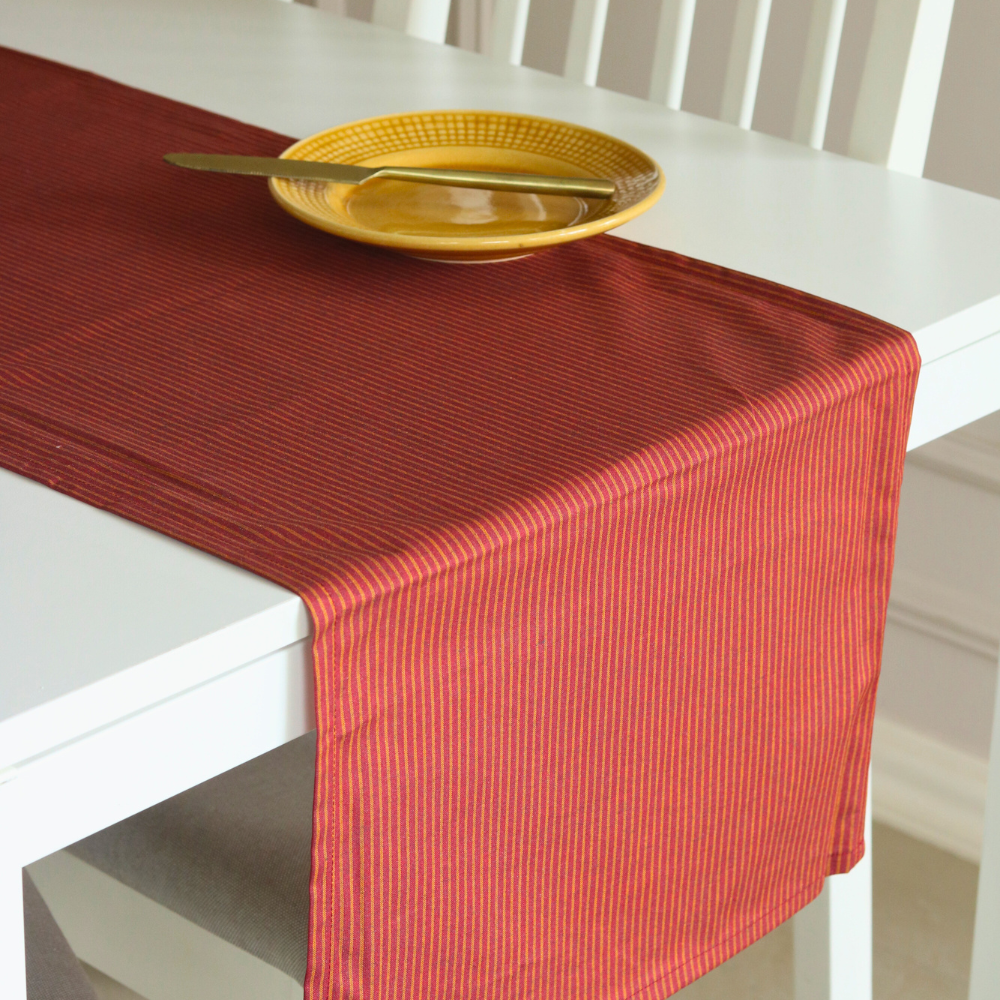 Serene Sunset Runner by The Yard House in bold red, 60"X14", featuring geometric patterns, perfect for festive dining.