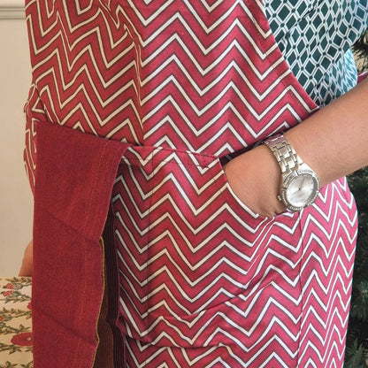 Spill-resistant, all-over red cotton apron with three pockets by The Yard House, perfect for kitchen essentials and new ar...