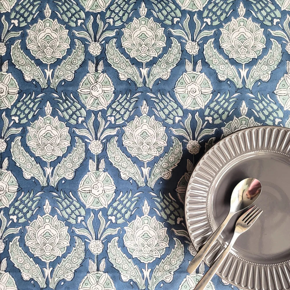 Stormy Skies Tablecloth by The Yard House in bold blue, featuring abstract patterns, available in round, square, and recta...