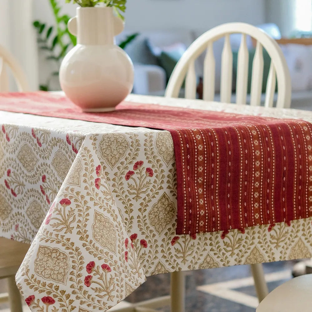Sweet Almond Tablecloth by The Yard House in brown and peach, featuring geometric patterns, available in various sizes.