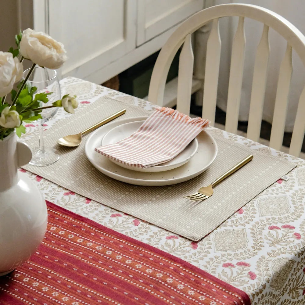 Sweet Almond Tablecloth by The Yard House in brown and peach, featuring geometric patterns, available in various sizes.