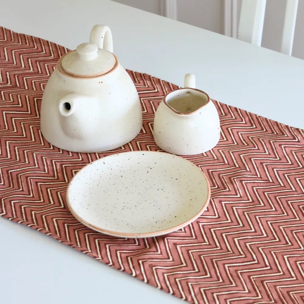 Sweet Onion (Chevron) table runner by The Yard House in bold pink, available in 4, 6, or 8-seater sizes, featuring abstrac...