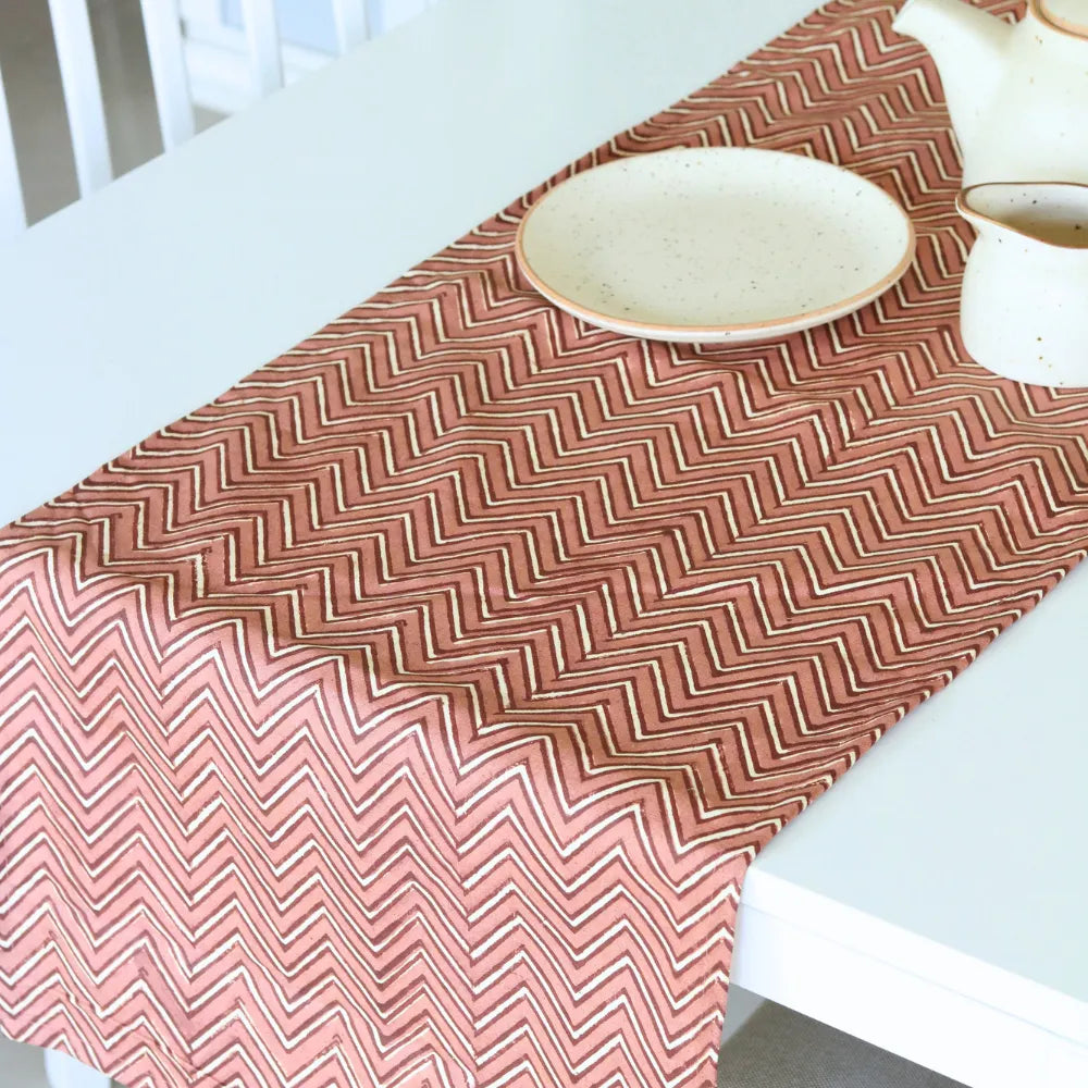 Sweet Onion (Chevron) table runner by The Yard House in bold pink, available in 4, 6, or 8 seater sizes with abstract patt...