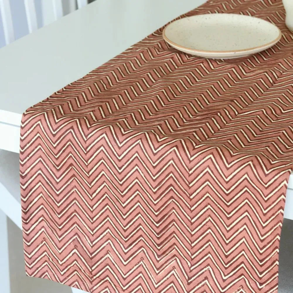 Sweet Onion (Chevron) table runner by The Yard House in bold pink, available in 4, 6, or 8 seater sizes with abstract patt...
