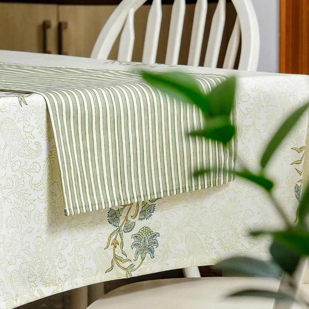 Whispering Willow Tablecloth by The Yard House in green and pale yellow, 60” square, featuring minimalist floral designs.