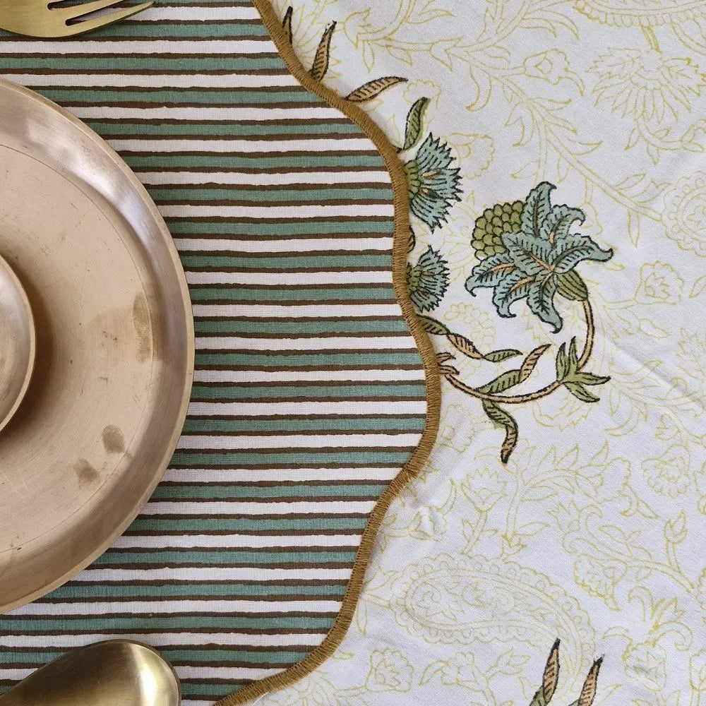 Whispering Willow Tablecloth by The Yard House in green and pale yellow, 60” square, featuring minimalist floral designs.