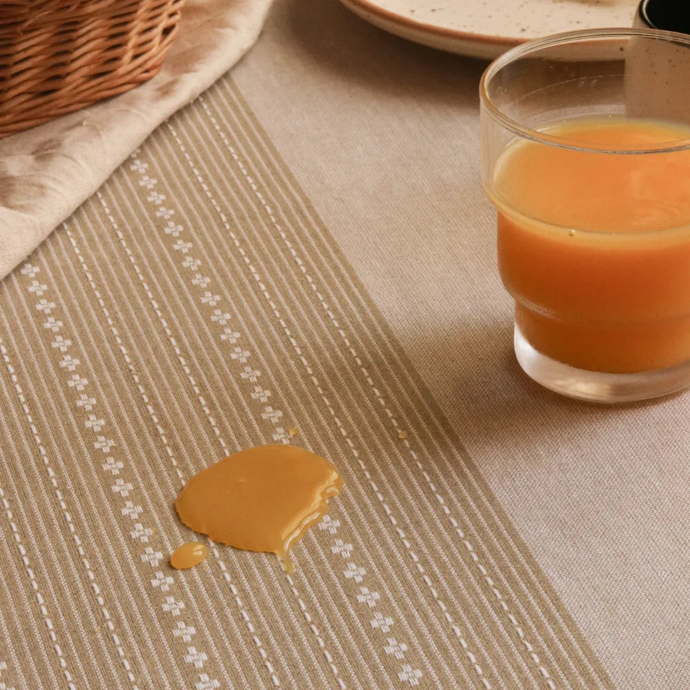 Woven Desert Sand Tablecloth by The Yard House, available in 60” square, round, or 48”x72” rectangle, featuring neutral to...