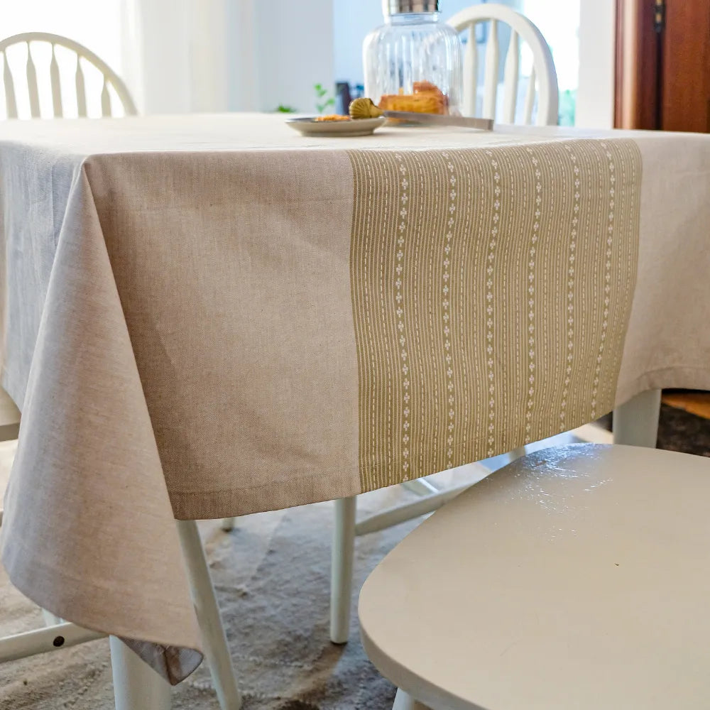 Woven Desert Sand Tablecloth by The Yard House, available in 60” square, round, or 48”x72” rectangle, featuring neutral to...